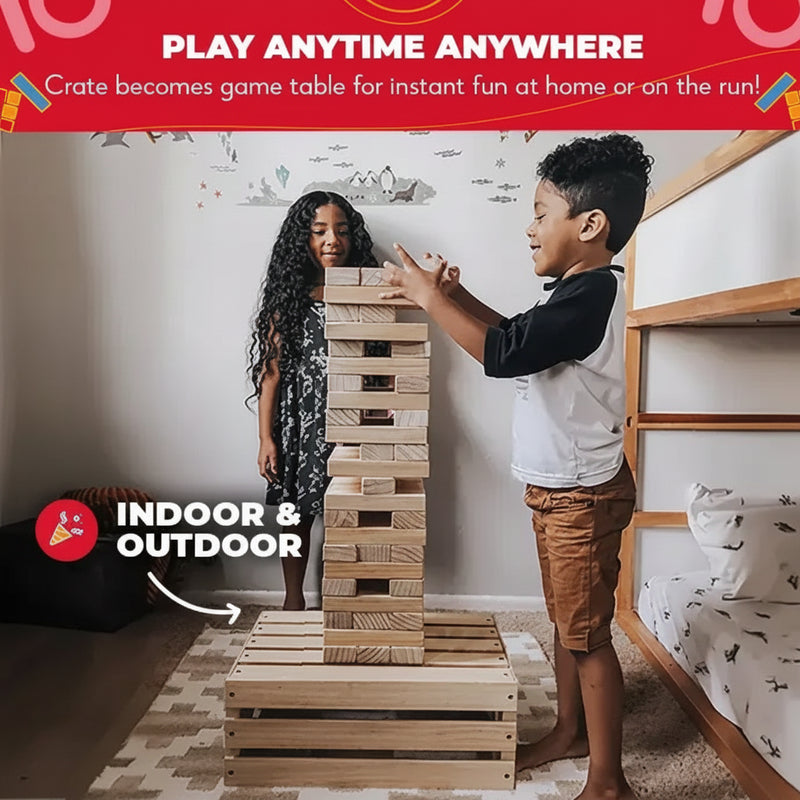 Two children playing a stacking block game on a wooden crate