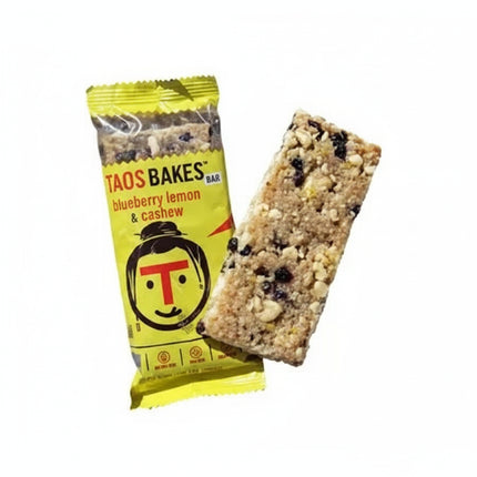 Taos Bakes blueberry lemon and cashew bar next to its yellow wrapper