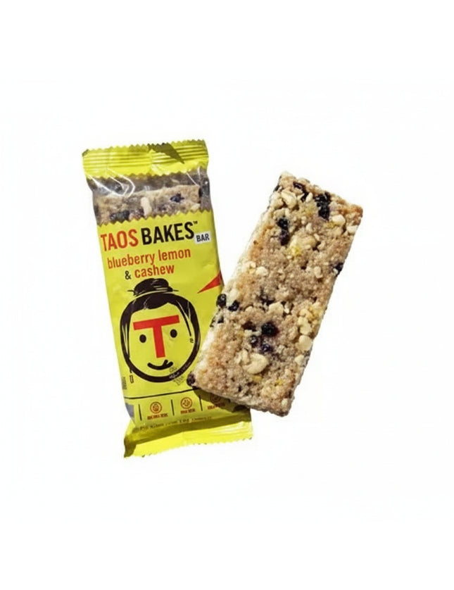 Taos Bakes blueberry lemon and cashew bar next to its yellow wrapper