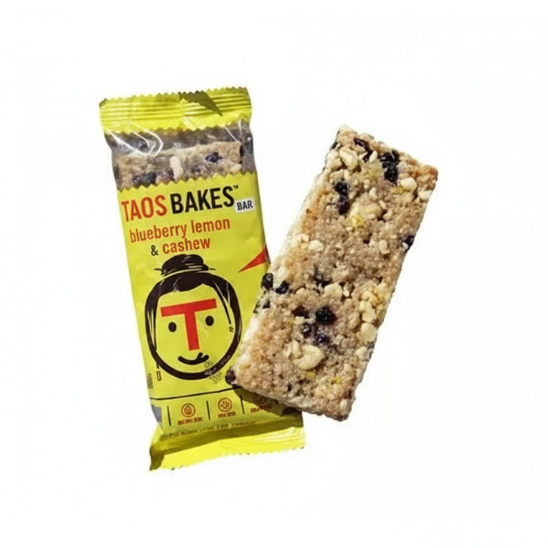 Taos Bakes blueberry lemon and cashew bar next to its yellow wrapper