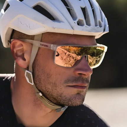 Man wearing a white cycling helmet and Tifosi sunglasses with reflective lenses