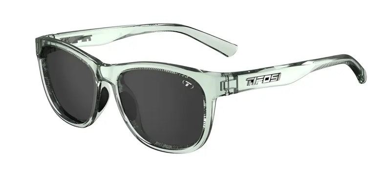 Light green sunglasses with dark lenses and the Tifosi logo on the side