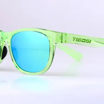 Tiedosi sunglasses with translucent green frames and blue mirrored lenses