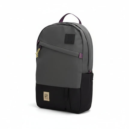 Two-tone grey and black backpack with purple accents and a gold rope zipper pull