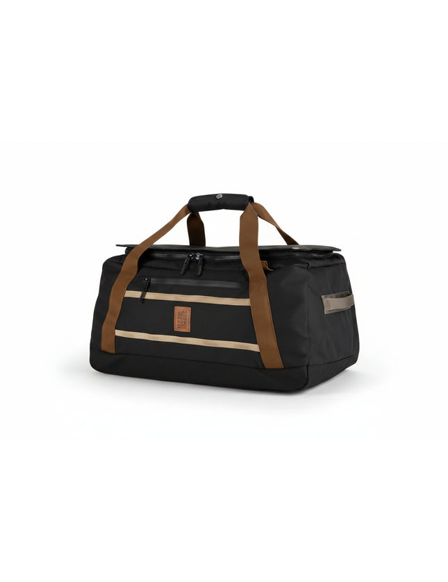 Black duffel bag with brown straps and tan accents