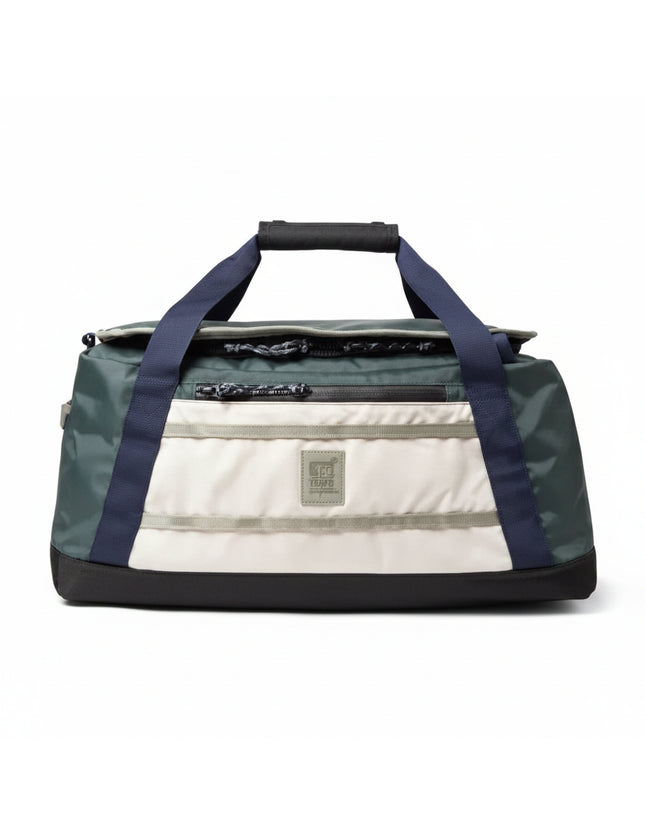 Green and white duffel bag with navy blue straps
