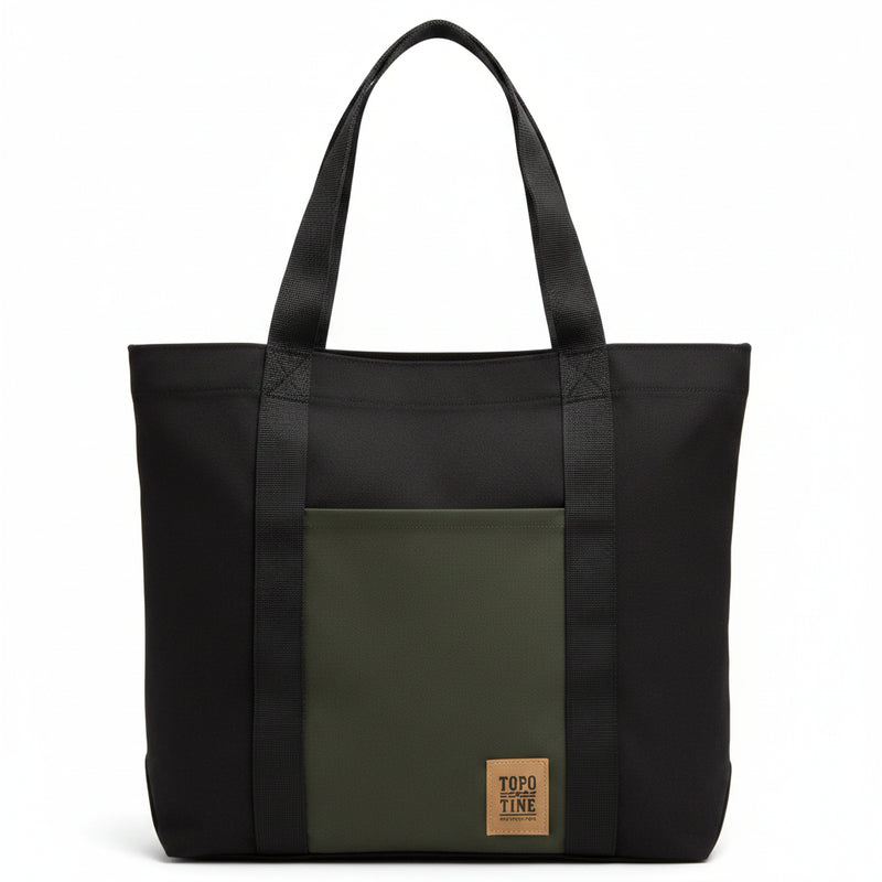 Black tote bag with a dark green front pocket and a brown TOPO TINE logo patch