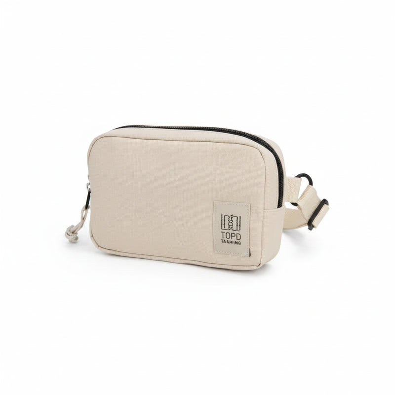 Topd Tarmiing beige rectangular pouch with black zipper and adjustable strap