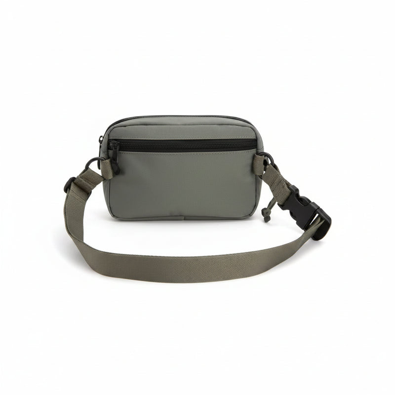 Olive green fanny pack with black zippers and adjustable strap