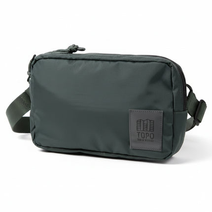 Dark green Topo Designs Rover Pack on a white background