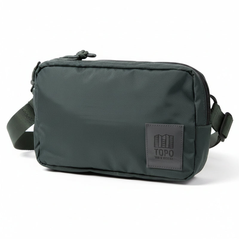 Dark green Topo Designs Rover Pack on a white background