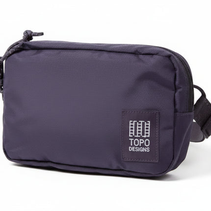 Topo Designs purple accessory bag with white logo