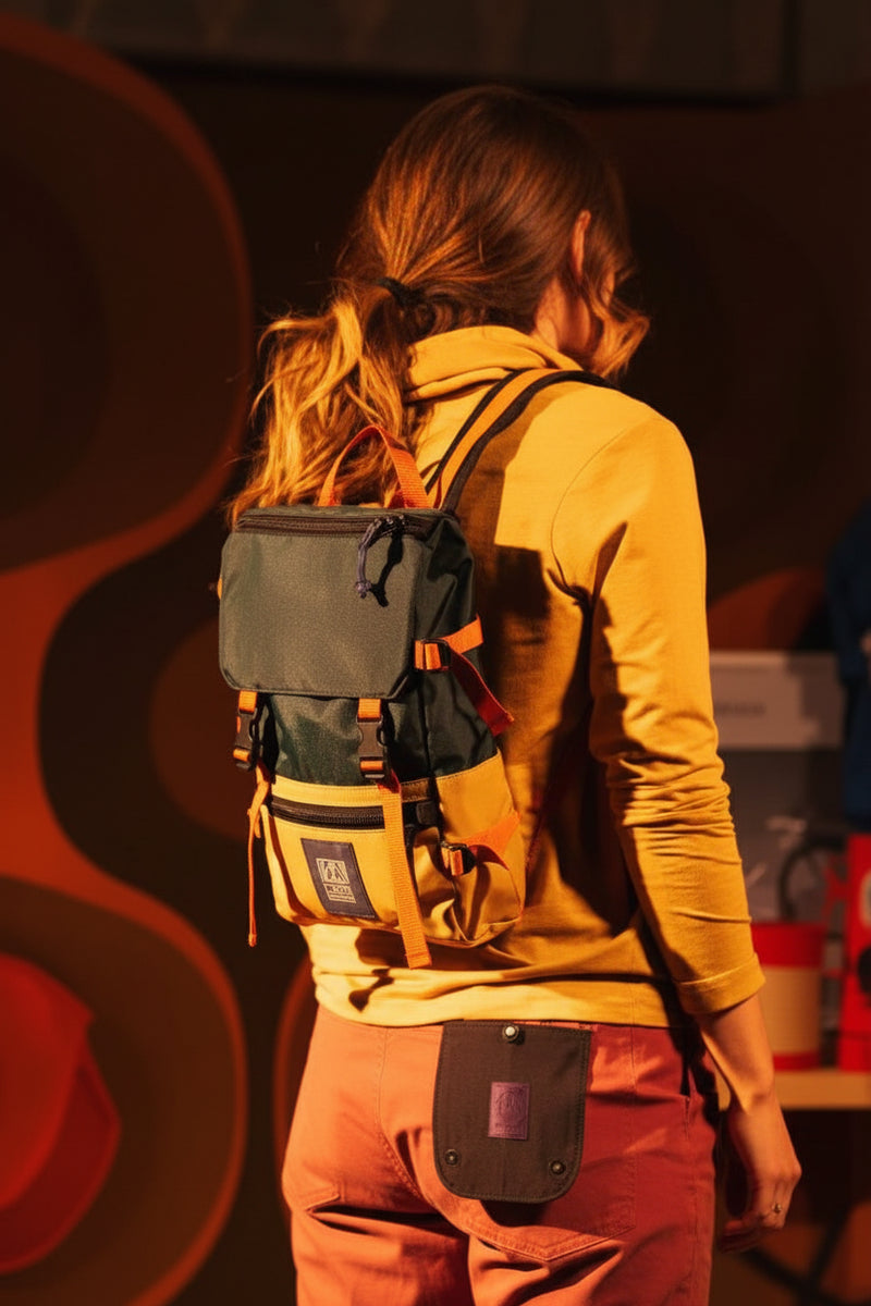 Person wearing a green and yellow backpack