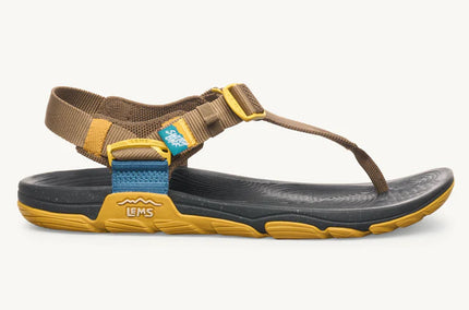 Brown sandal with yellow straps on a white background