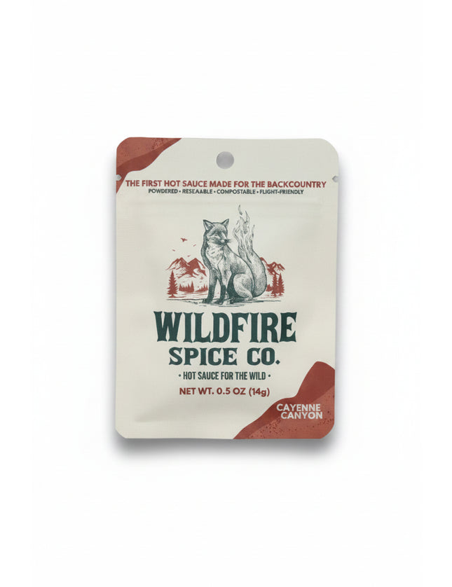 Wildfire Spice Co Cayenne Canyon hot sauce packet with a fox and mountains graphic