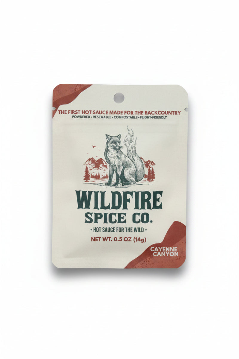 Wildfire Spice Co Cayenne Canyon hot sauce packet with a fox and mountains graphic